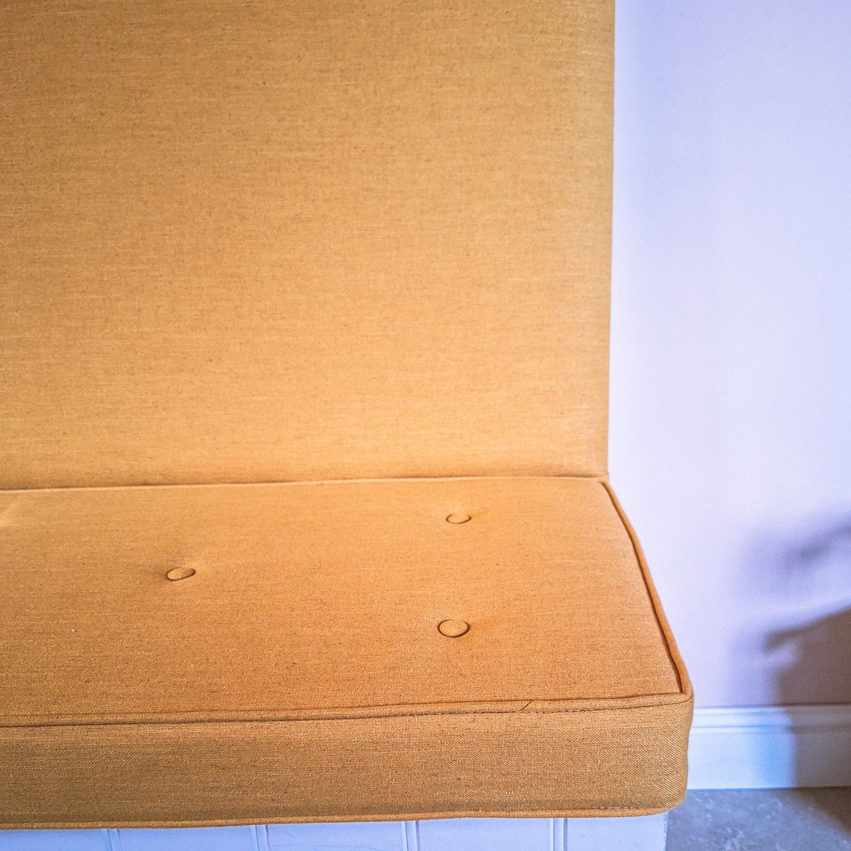 Buttoned and piped bench cushion