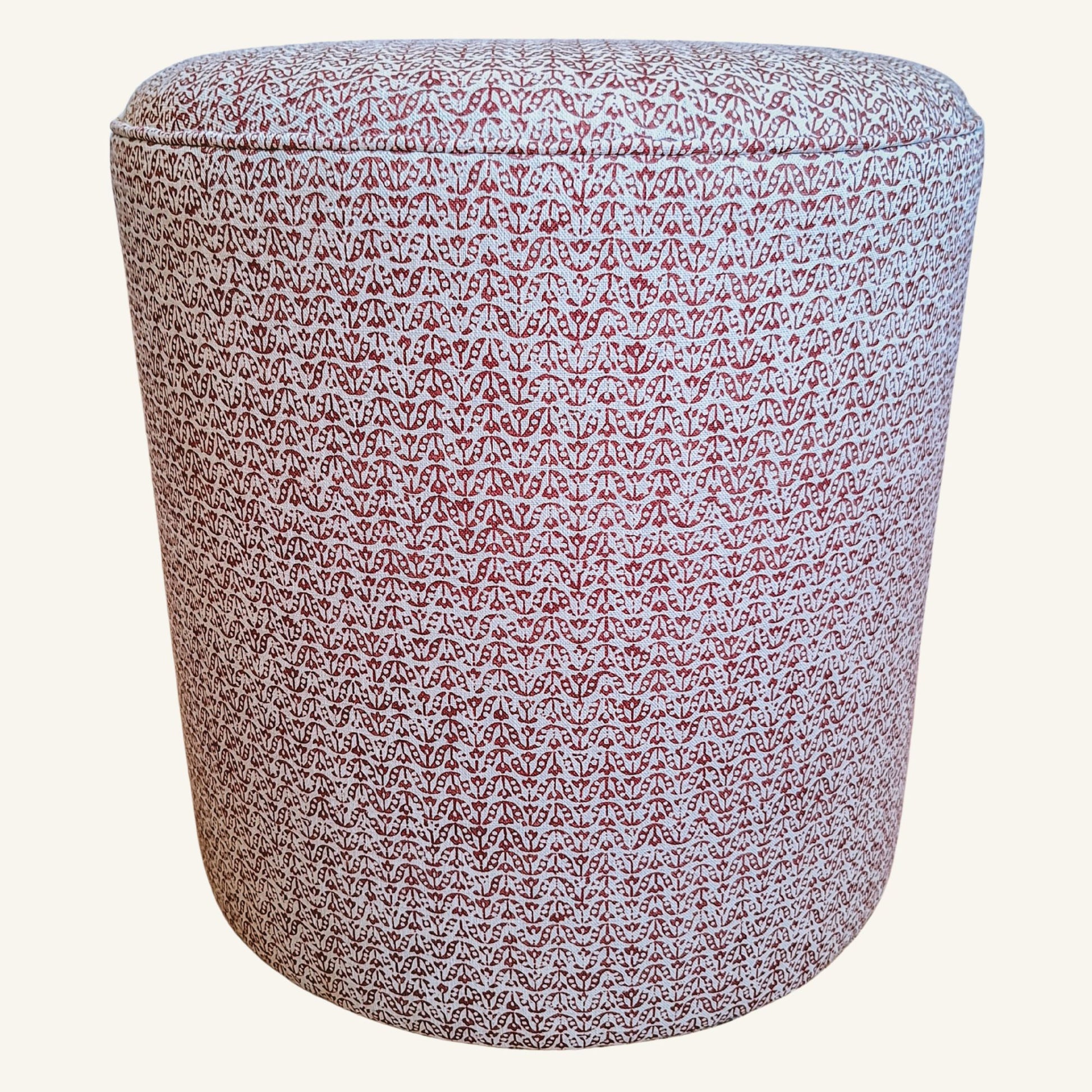 Patterned cylindrical ottoman on a white background
