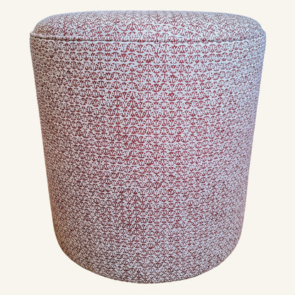 Patterned cylindrical ottoman on a white background