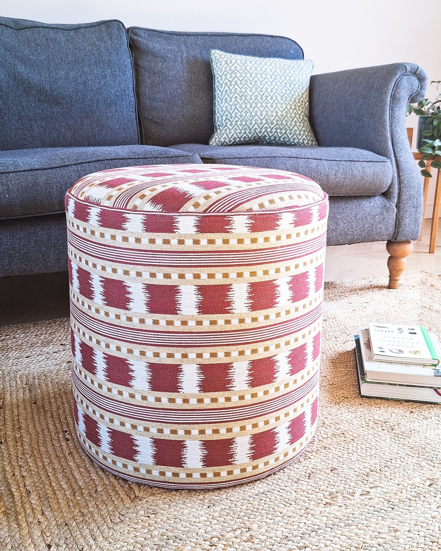 stool upholstered in red and ochre ikat fabric