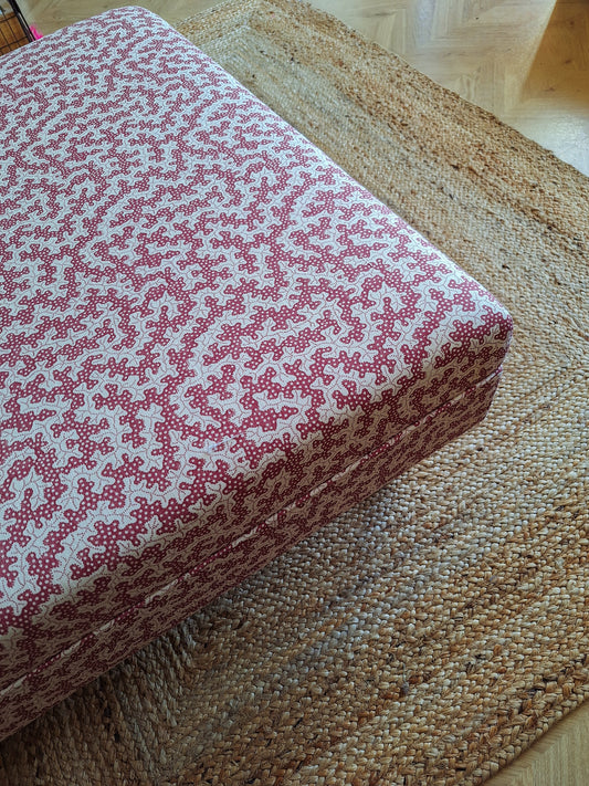 Custom upholstered ottoman in patterned Sanderson truffle fabric by North End Interiors