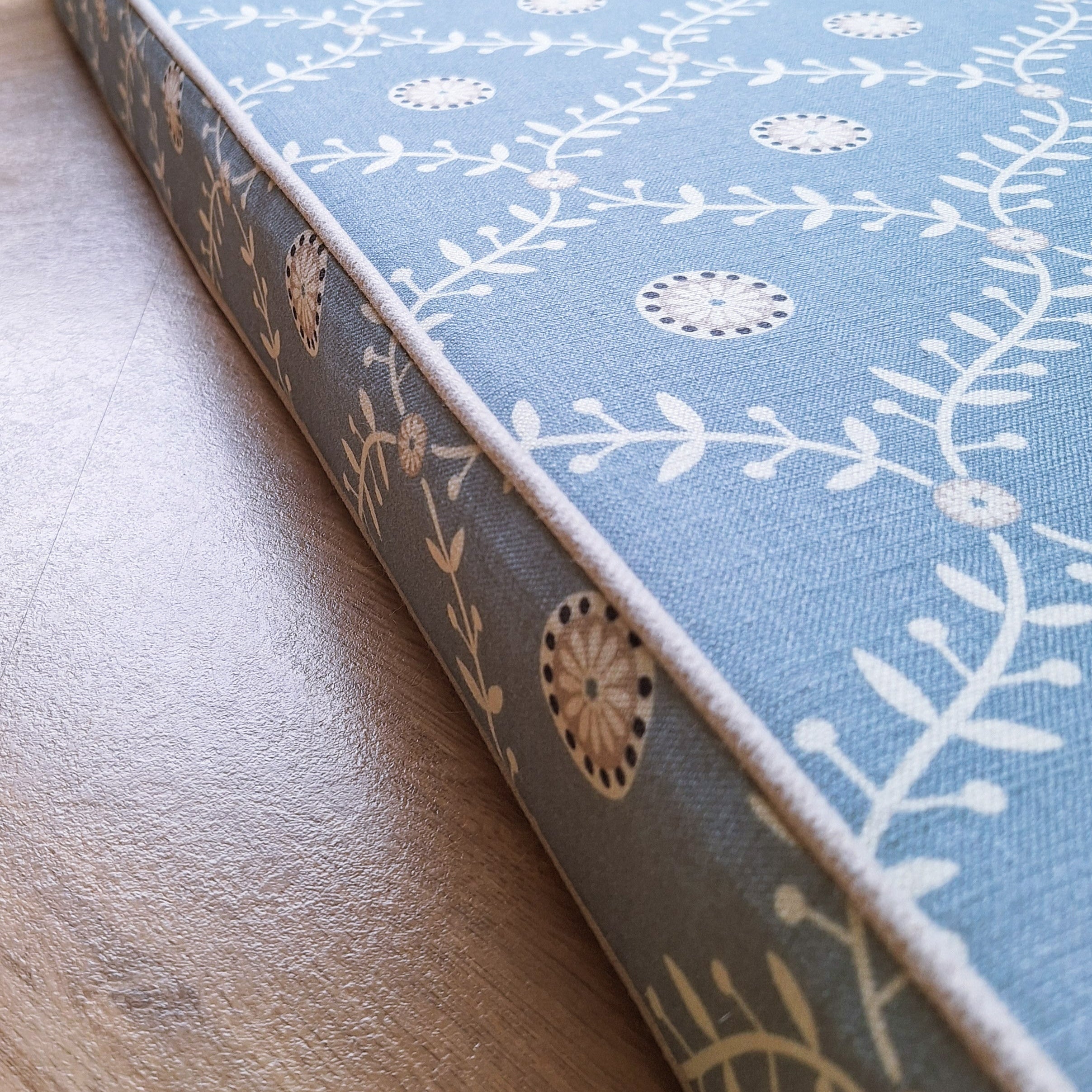 trellis patterned window seat cushion in blue