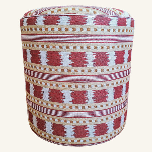 Patterned round stool with red, white, and beige colors on a white background